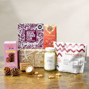 Gift Box for Couples with bath salts, brownie mix, chocolate, biscuits, and a candle. The perfect ethical gift box.