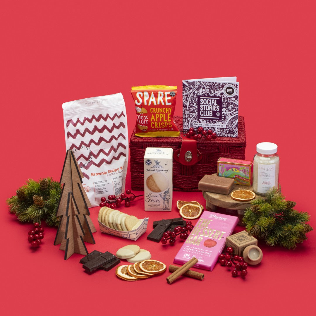 Thinking of You Gift Hamper open, showcasing lemon melt biscuits, cherry almond dark chocolate Bakewell, lavender candle, apple crisps, citrus vanilla bath salts, brownie kit, rosemary orange soap, story booklet, and personalised note in soothing sustainable packaging with gentle festive accents.