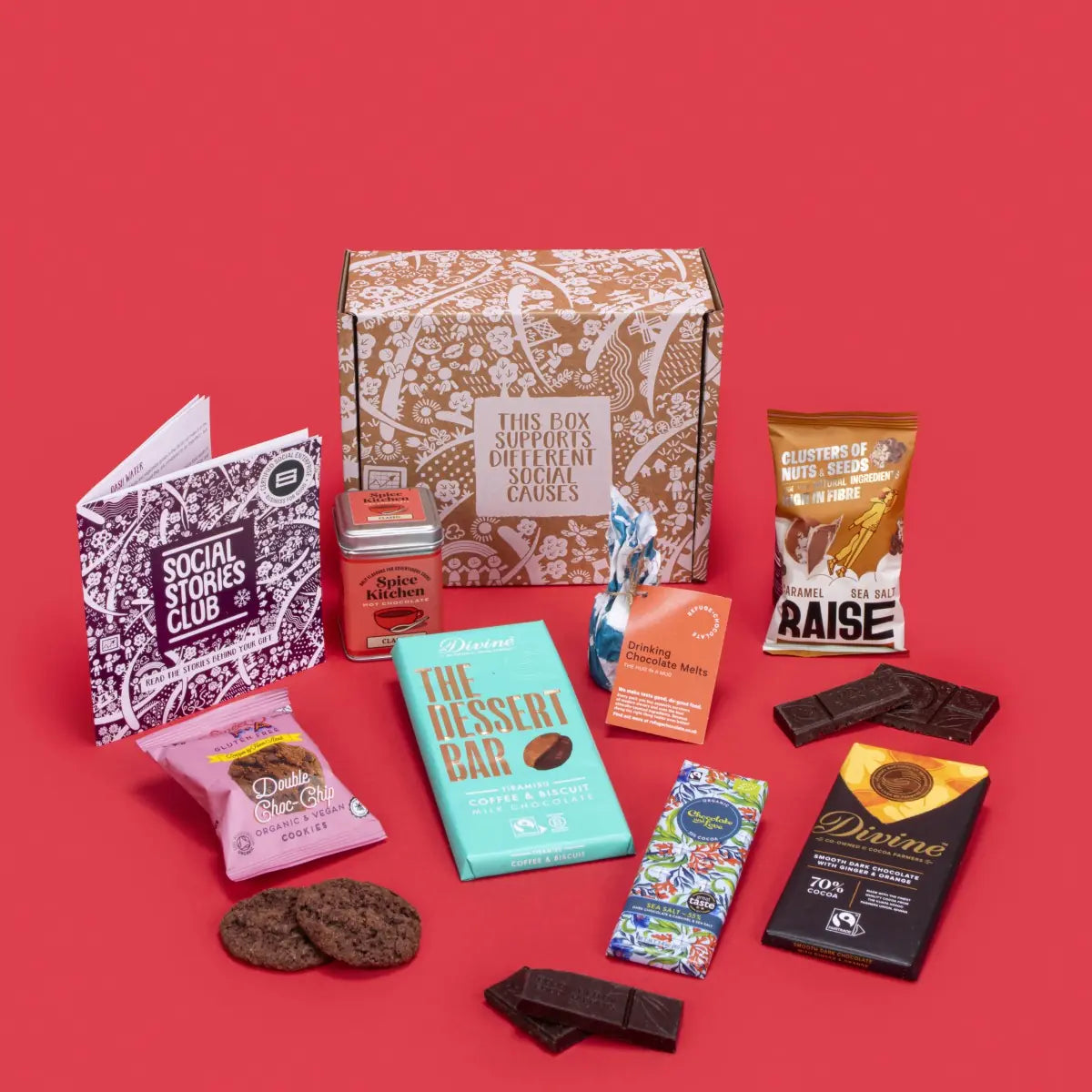 Chocolate Heaven open, overflowing with double chocolate chip cookies, sea salt caramel chocolate, ginger orange dark chocolate, tiramisu milk chocolate, hot chocolate, salted caramel seeds and nuts, hot chocolate melts, story booklet, and personalised note in tempting sustainable packaging with festive chocolate accents.