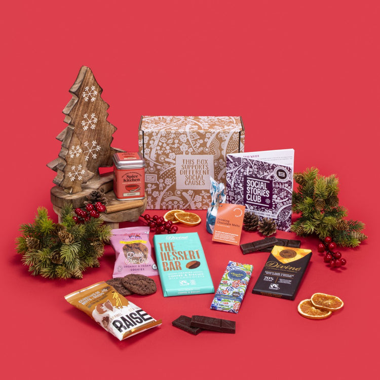 Chocolate Heaven open, overflowing with double chocolate chip cookies, sea salt caramel chocolate, ginger orange dark chocolate, tiramisu milk chocolate, hot chocolate, salted caramel seeds and nuts, hot chocolate melts, story booklet, and personalised note in tempting sustainable packaging with festive chocolate accents.