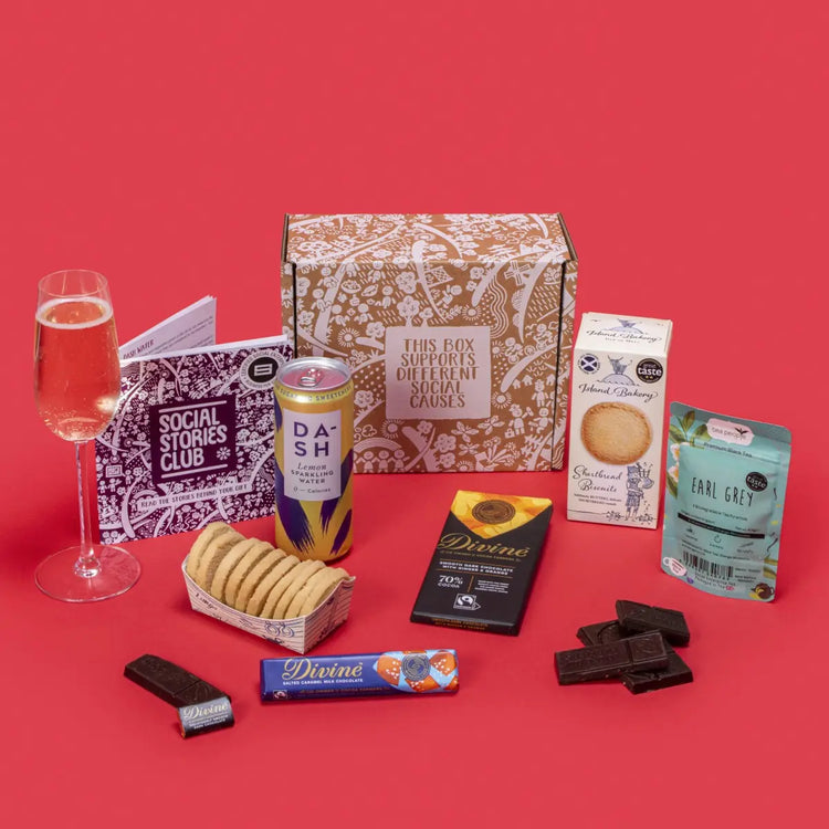 Conscious Collection open, displaying twin-pack Earl Grey tea, shortbread biscuits, ginger orange dark chocolate, salted caramel milk chocolate, napolitain, lemon sparkling water, story booklet & personalised note in elegant sustainable packaging with festive accents.