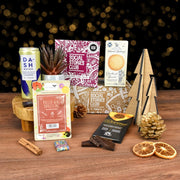 Conscious Collection gift box by Social Stories Club, featuring ethical treats and sustainable items.