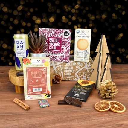 Conscious Collection gift box by Social Stories Club, featuring ethical treats and sustainable items.