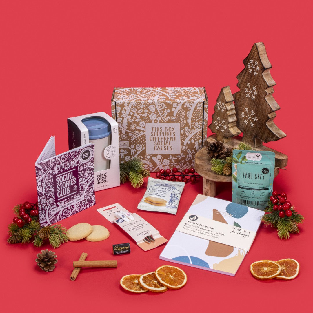 Employee Onboarding Gift Box open, showcasing twin-pack Earl Grey tea, shortbread biscuits, dark chocolate napolitain, A5 notebook, recycled pencil set, coffee cup, story booklet, and personalised note in professional sustainable packaging with welcoming accents.