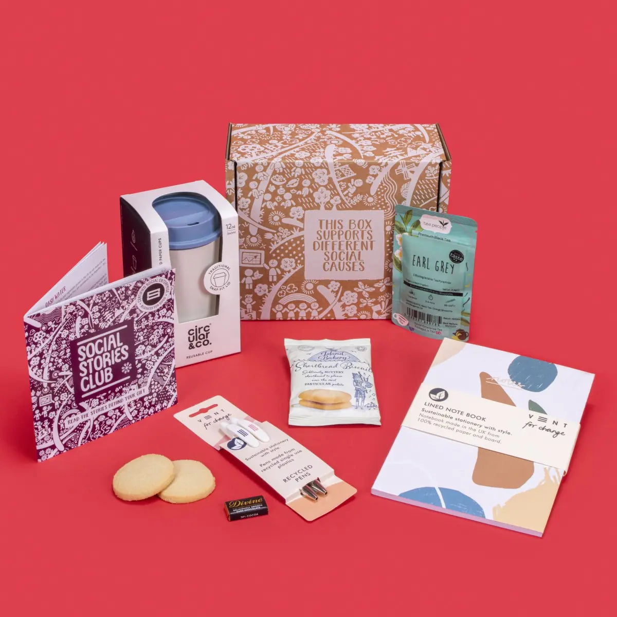 Employee Onboarding Gift Box open, showcasing twin-pack Earl Grey tea, shortbread biscuits, dark chocolate napolitain, A5 notebook, recycled pencil set, coffee cup, story booklet, and personalised note in professional sustainable packaging with welcoming accents.