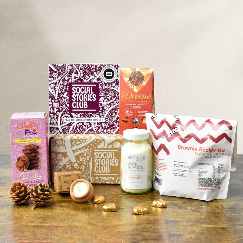 Gift Box for Couples with bath salts, brownie mix, chocolate, biscuits, and a candle. The perfect ethical gift box.