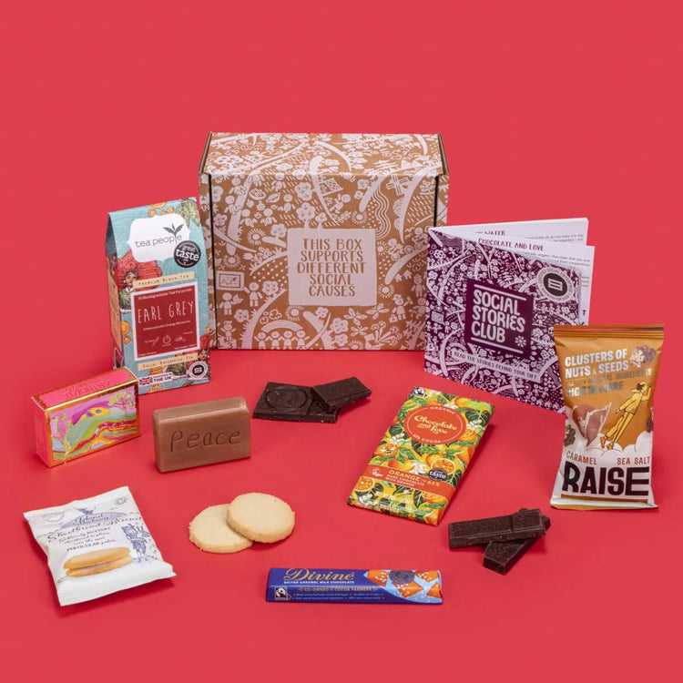 Happy Birthday Gift Box open, displaying Earl Grey tea, twin-pack shortbread, sea salt caramel chocolate, organic soap, salted caramel milk chocolate, salted caramel seeds and nuts, story booklet & personalised note in celebratory sustainable packaging with birthday accents.