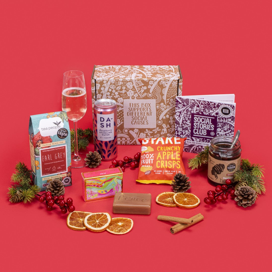Healthcare Hero Thank You Gift Box open, displaying Earl Grey tea, apple crisps, pure honey jar, raspberry sparkling water, rosemary orange exfoliating soap, story booklet, and personalised note in appreciative sustainable packaging with subtle heroic motifs.