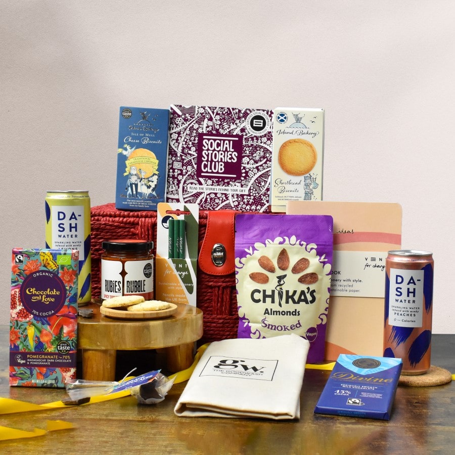 Let's Make Impact Gift Hamper. Gift hamper with lots of sustainable products such as drinks and biscuits with social stories of sustainability.