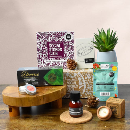 Self Care Package - Sustainable Gift UK. This image of a social stories gift shows sustainable products surrounding a social enterprise gift box.