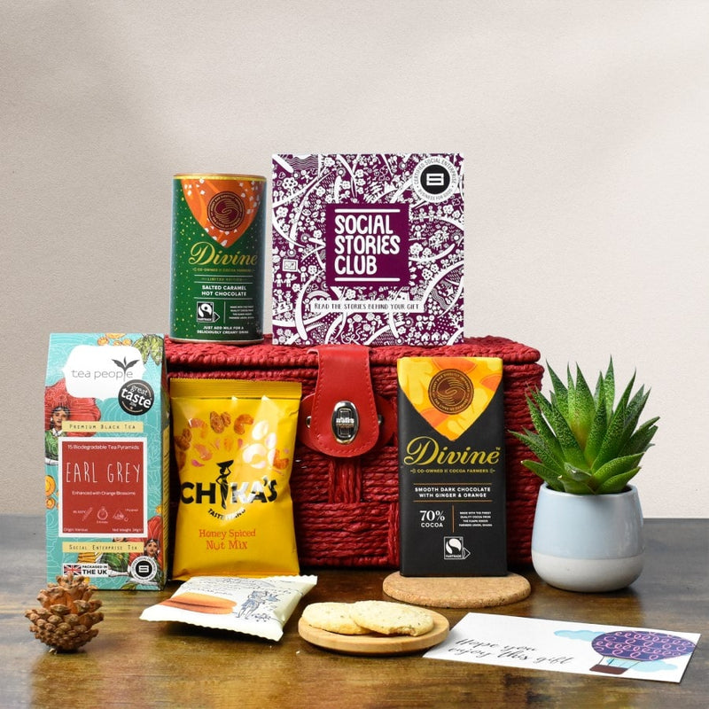Social Impact Gift Hamper- A reusable gift hamper is surrounded by sustainable products. This is a gift with a story and the story booklet shares these social stories.