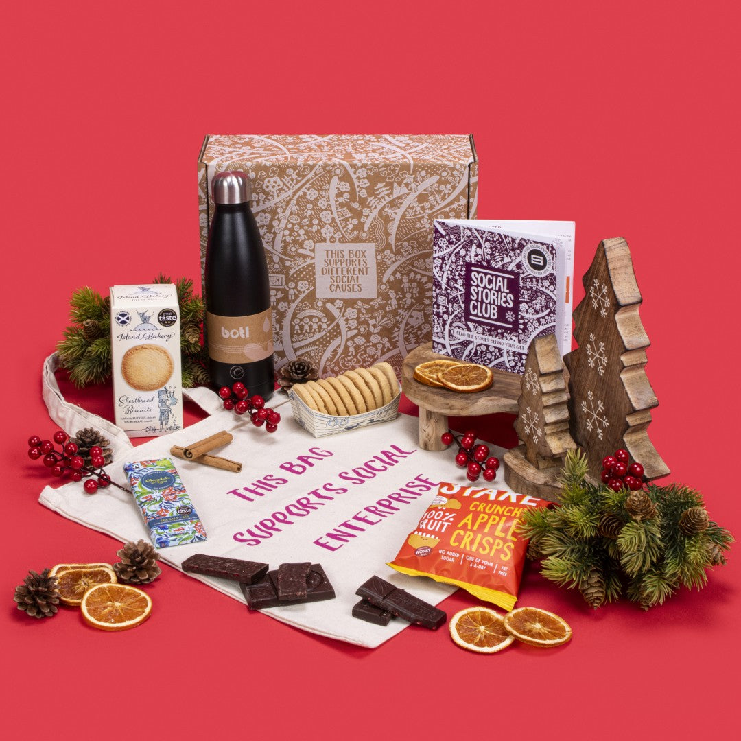 Staff Appreciation Gift Box open, showcasing shortbread biscuits, sea salt caramel chocolate, apple crisps, natural cotton tote bag, ocean-rescue water bottle, story booklet, and personalised note in professional sustainable packaging with subtle festive accents.