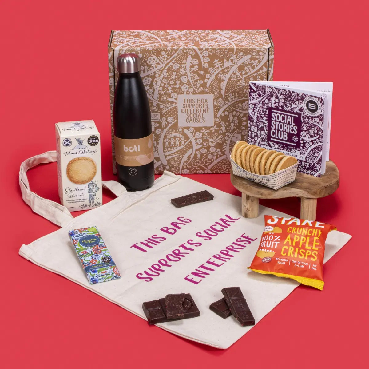 Staff Appreciation Gift Box open, showcasing shortbread biscuits, sea salt caramel chocolate, apple crisps, natural cotton tote bag, ocean-rescue water bottle, story booklet, and personalised note in professional sustainable packaging with subtle festive accents.