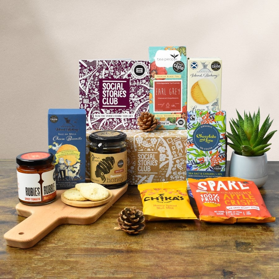 Sustainable Foodie Gift Box. Social enterprise gift box surrounded by food products that are perfect for snacking.