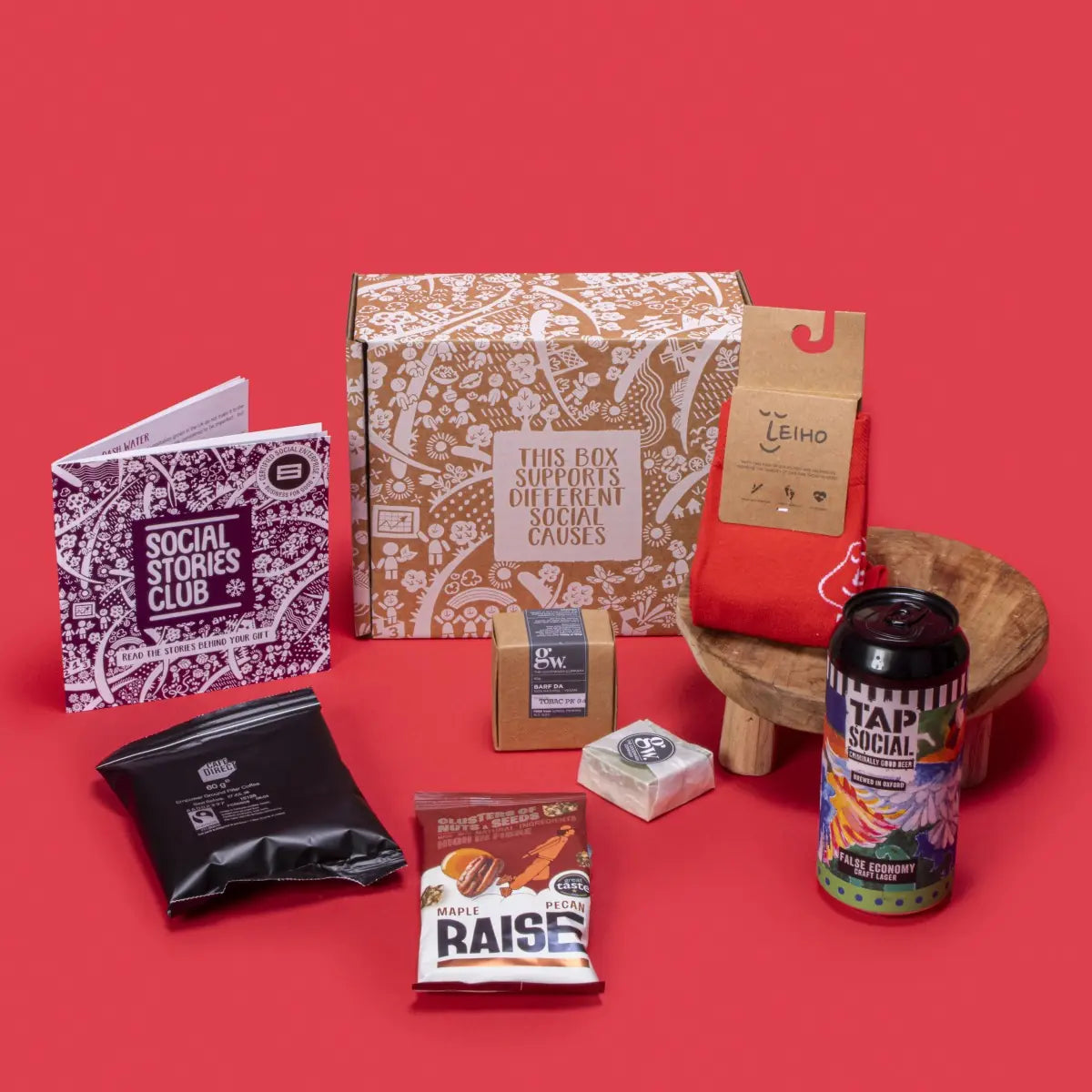 Sustainable Gift for Him open, showcasing smooth filter coffee, maple pecans, handmade beard bar, bamboo socks, craft lager, story booklet, and personalised note in rugged sustainable packaging with masculine festive accents.