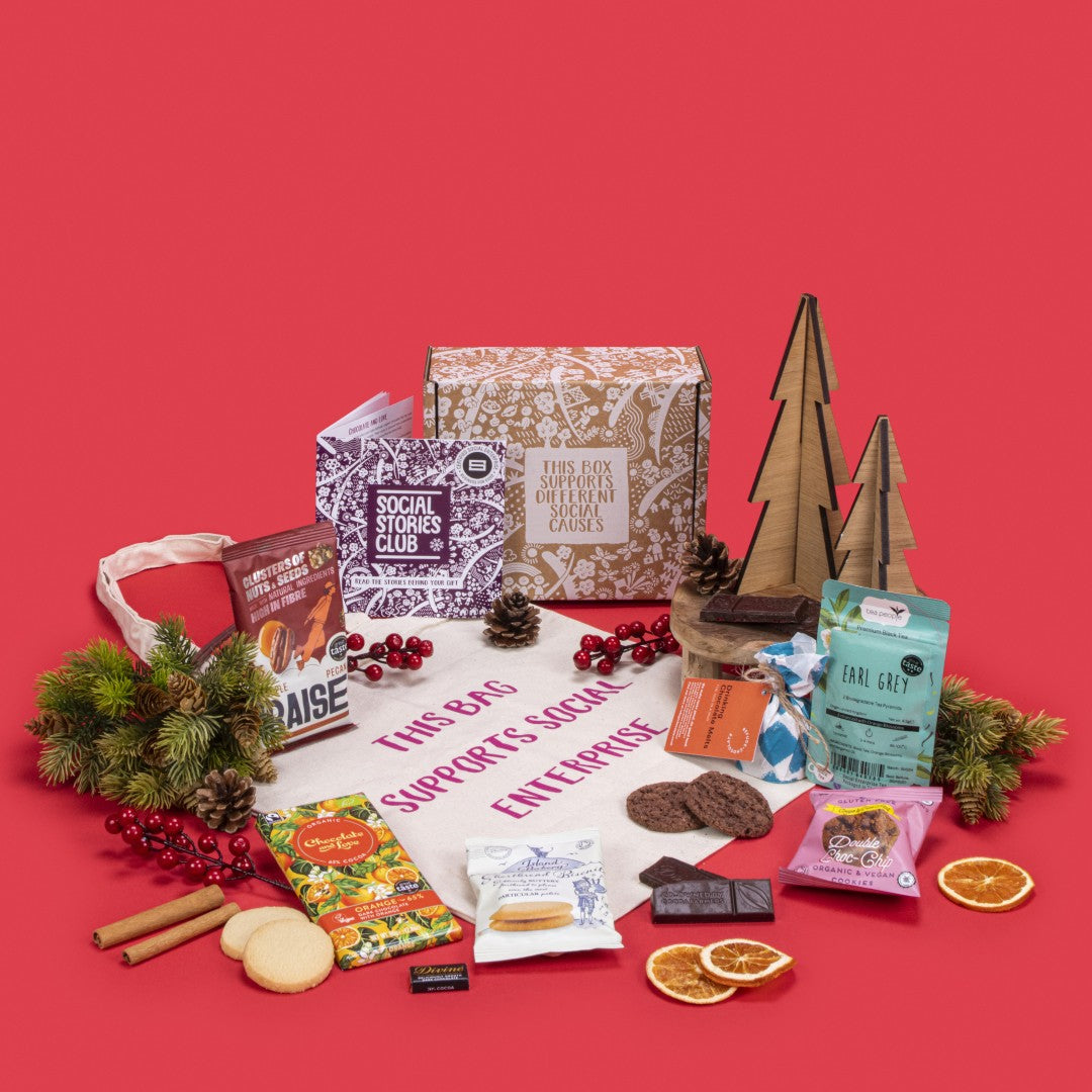 Thank You Teachers Gift Box open, filled with Earl Grey tea twin pack, shortbread and chocolate chip cookies, orange dark chocolate, napolitain, maple pecan nuts, cotton tote bag, hot chocolate melts, story booklet, and personalised note in cosy sustainable packaging with festive end-of-year warmth.