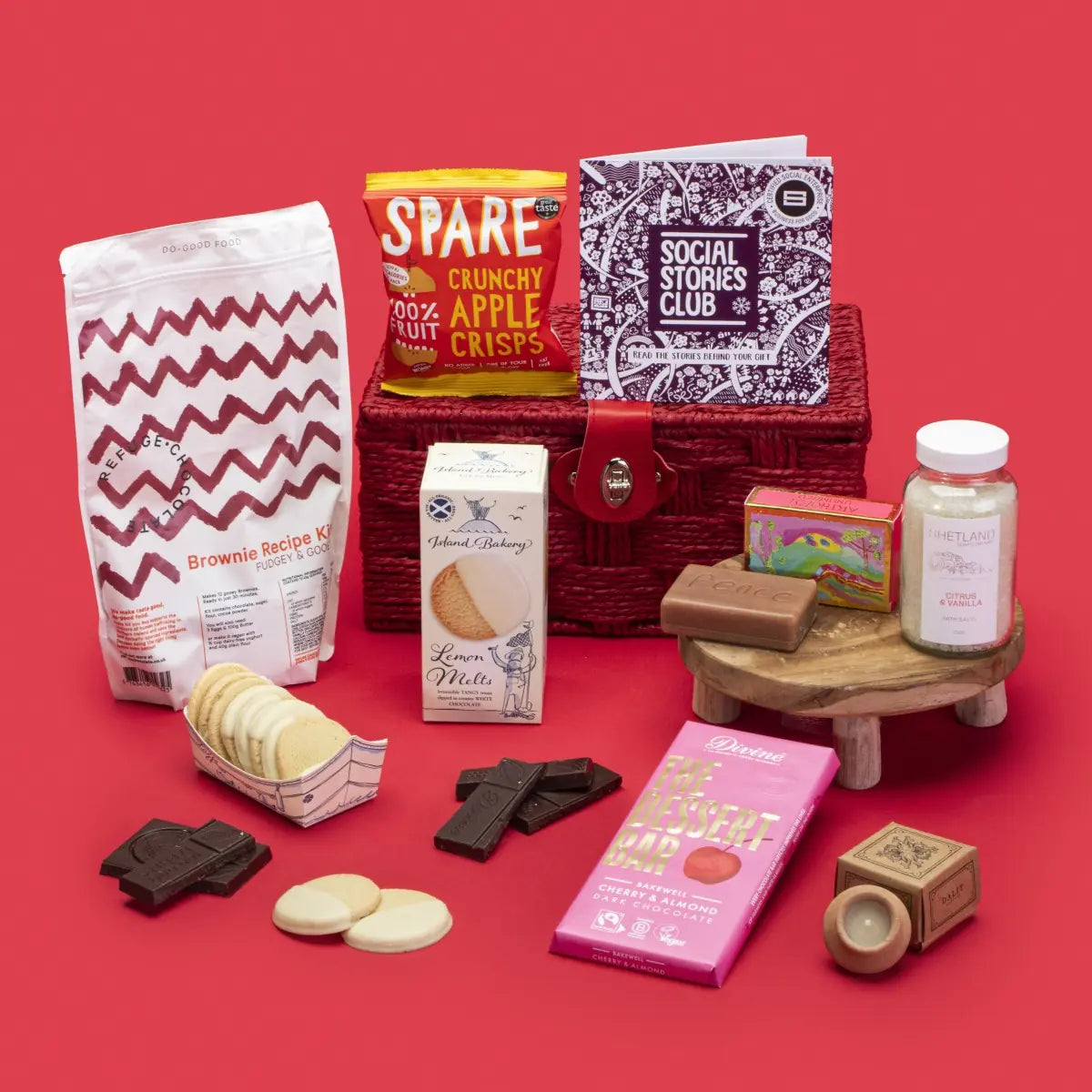 Thinking of You Gift Hamper open, showcasing lemon melt biscuits, cherry almond dark chocolate Bakewell, lavender candle, apple crisps, citrus vanilla bath salts, brownie kit, rosemary orange soap, story booklet, and personalised note in soothing sustainable packaging with gentle festive accents.