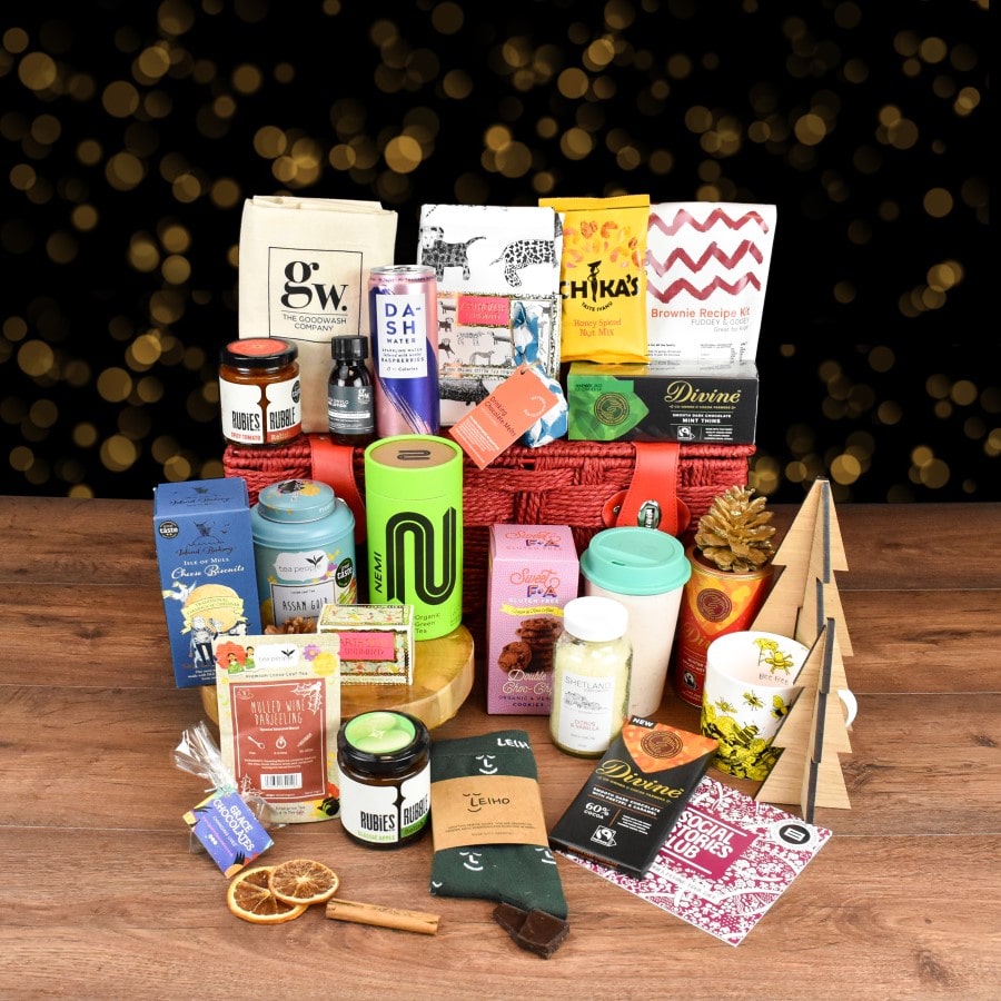 Ultimate Christmas Gift Hamper featuring ethical products like bamboo socks, tea, chocolate, and more, supporting various social and environmental causes.