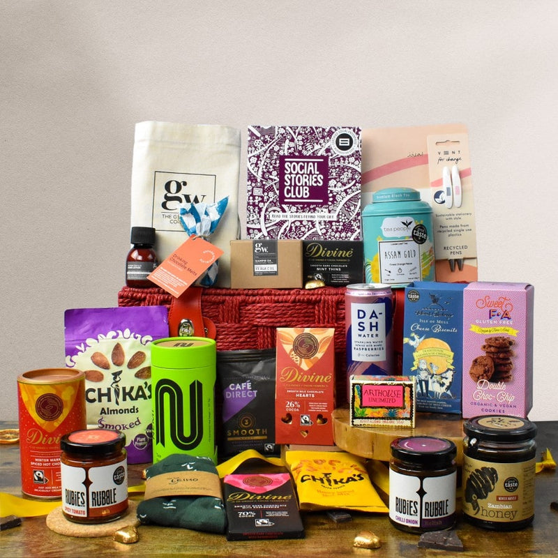 Ultra Impact Gift Hamper - This is an image of a luxury gift hamper. A reusable gift hamper is surrounded by sustainable social enterprise products with social stories of how they create an impact included inside a story booklet.