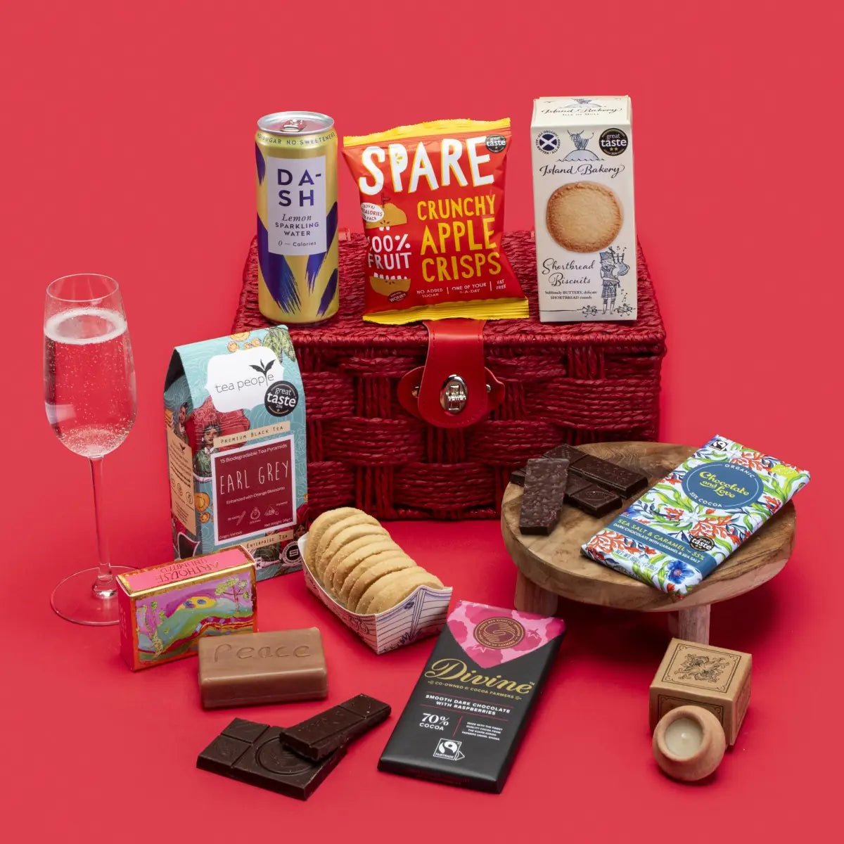Original Social Stories Gift Hamper: a wicker hamper with chocolate, shortbread, tea, apple crisps and sparkling water