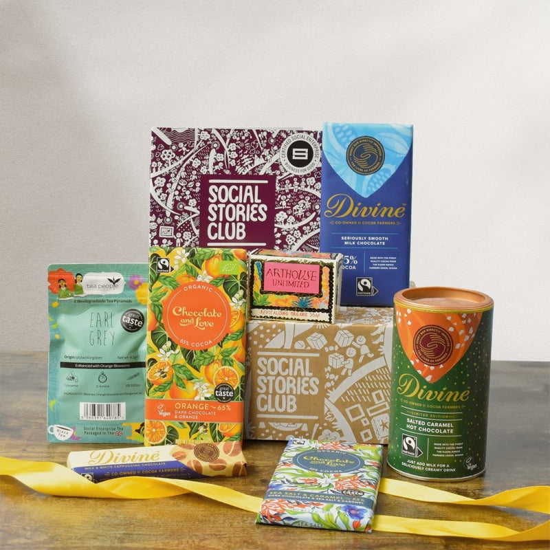 Pick Me Up Gift Box. This is a gift box designed to cheer someone up. The photo shows the social enterprise products surrounding a sustainable giftbox. A story book lies beside it with the social stories behind the gift.