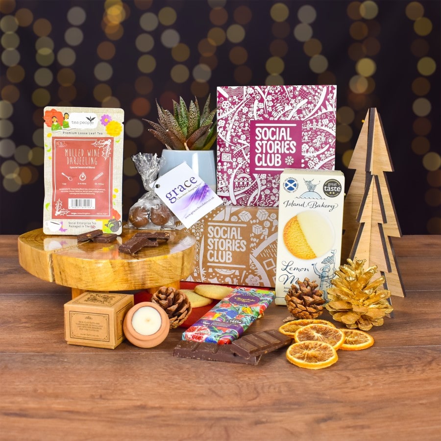 Secret Santa Gift Box - This image shows the Christmas gift box surrounded by sustainable products making it the perfect sustainable secret santa gift.